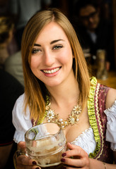 Girl drinking beer at Oktoberfest