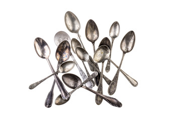 Collection of antique teaspoons over white background