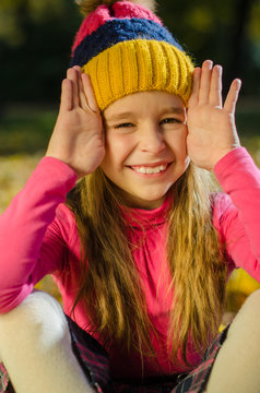 Pretty smiling girl making cuckoo