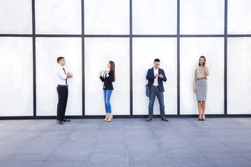 Fototapeta premium Young business team in front of the modern office building