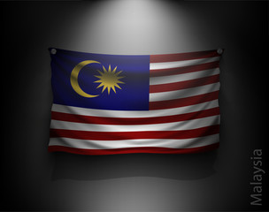 waving flag malaysia on a dark wall