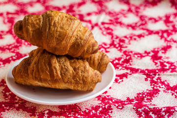 Croissants, big, delicious croissants on a table. Fresh bakery