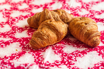 Croissants, big, delicious croissants on a table. Fresh bakery