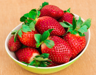 Strawberries. Organic Closeup with mint, natural non GMO rustic