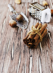 Bundle of cinnamon with nuts and flowers 
