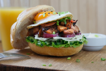 Delicious Egg Burger On Wooden Plate close view