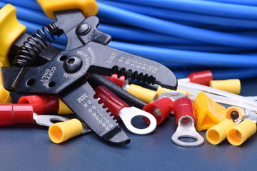 Fototapeta premium Tools for electrician and cables on metal surface