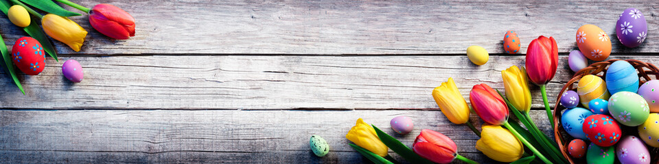 Tulips And Painted Eggs On Vintage Wooden Plank - Easter Background
