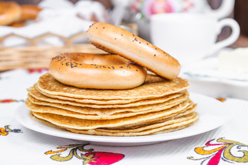 Pancakes and bagels on a plate