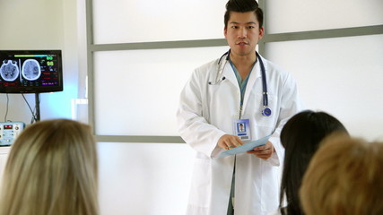 A young enthusiastic medical team leader preparing the staff for some demanding teamwork.