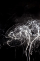 White smoke on a black background.