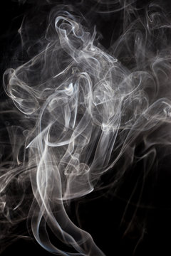 White smoke on a black background.