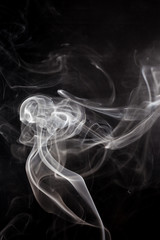 White smoke on a black background.