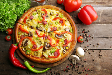 Delicious sliced pizza with vegetables, close-up