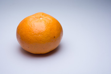 Tangerine isolated on light grey background