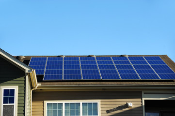 Fototapeta premium modern apartment and solar panels installed on roof