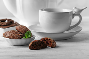 Chocolate chip cookie in plate with mint, closeup
