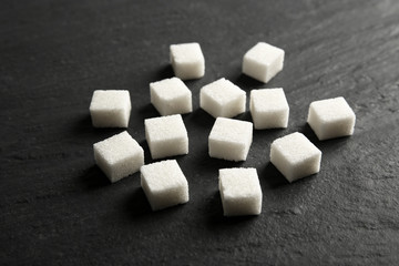 Pile of sugar cubes on the table