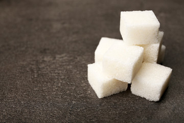 Pile of sugar cubes on the table