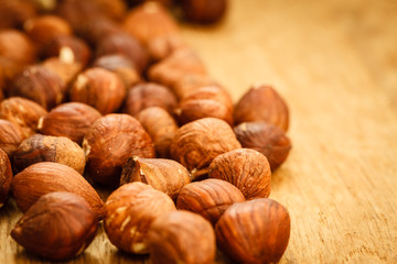 Hazelnuts on rustic old wooden table