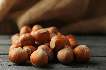 Hazelnuts on the wooden table, close-up