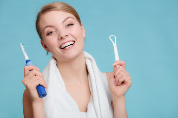 Girl with brush and tongue cleaner. - obrazy, fototapety, plakaty