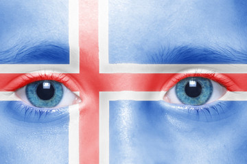 child's face with icelandic flag
