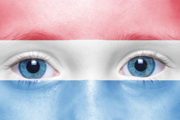 child's face with dutch flag