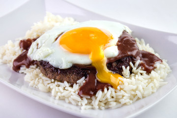 Loco Moco , traditional Hawaiian cuisine , burger patty on rice with a fried egg and sauce
