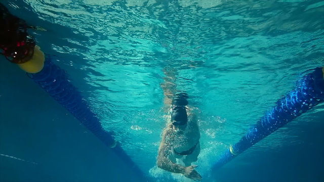 Underwater view of man swimming