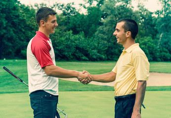 Golfers shaking hands