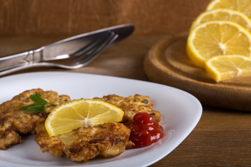 Ketchup with a wiener schnitzel