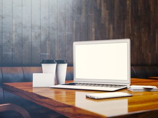 Set of generic design laptop, businesscards, smartphone and blank coffe cups on the table in modern interior at background. 3d render