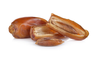 whole and half cut date palm fruit on white background
