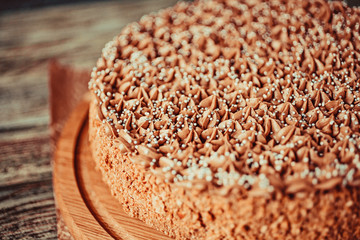 Homemade chocolate cake in rustic style on vintage background. Shallow depth of field.