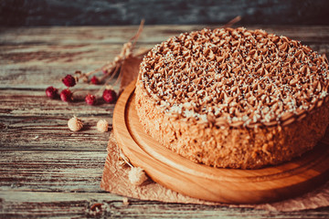 Homemade chocolate cake in rustic style on vintage background. Shallow depth of field.