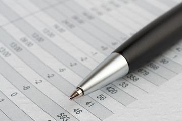 Black ballpoint pen on a sheet of figures