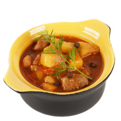 Black clay pot with braised potatoes.