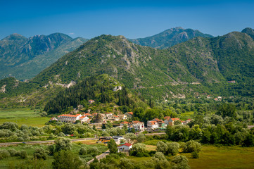 Fototapeta na wymiar Aerial Montenegro landscape with Virpazar town and mountains of Skadar lake national park.
