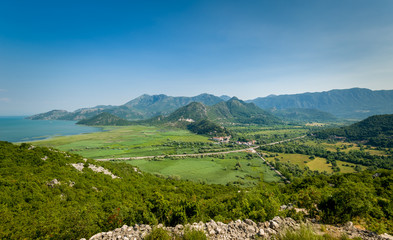 Fototapeta na wymiar Montenegro landscape with Virpazar town, Skadar lake national park and the mountains range