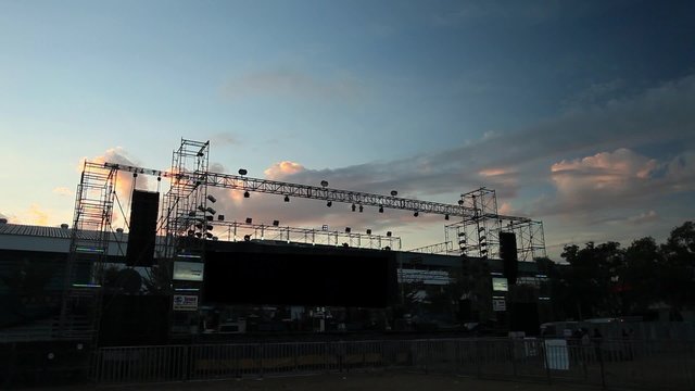 Clouds Time lapse setting up a stage lighting equipment before the concert.