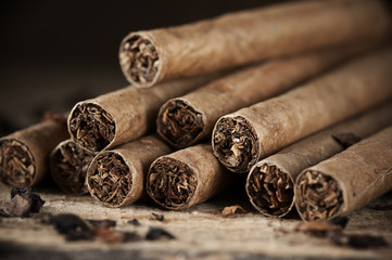Cigars pile on wood