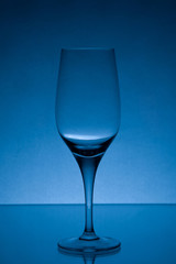 empty wine glass studio light blue shot 3