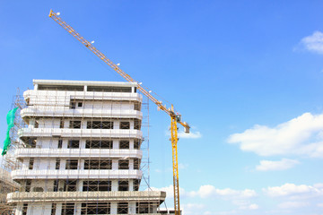 Building under construction tower with crane