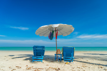 beds and umbrella on a beach