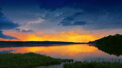 Fototapeta premium orange sunset over river