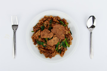 Stir fried flat noodle and pork with dark soy sauce (Thai people called Pad See Ew)