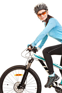 Smiling adult woman cyclist  riding a bicycle isolated on white background. Studio shot.