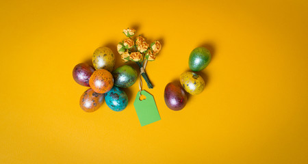 Easter colorful eggs handmade paper flowers and blank note 