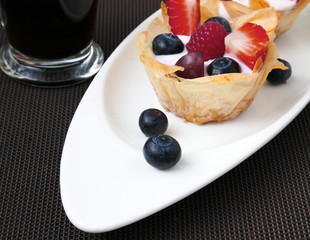 Home made desserts tarts of filo pastry with yoghurt and assorted berries